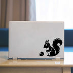 Squirrel Laptop Decal. Squirrel looking at acorn graphic.