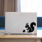 Squirrel Laptop Decal. Squirrel looking at acorn graphic.